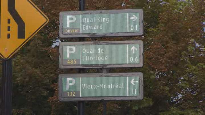 Digital parking signs show which parking lots are open and how many spots are available. Montreal, Aug. 29, 2018.