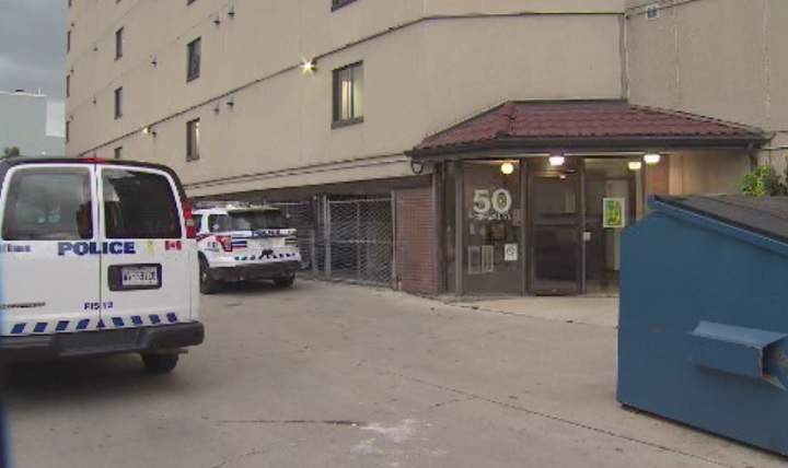 Police investigate the scene of Toronto's 70th homicide of 2018.