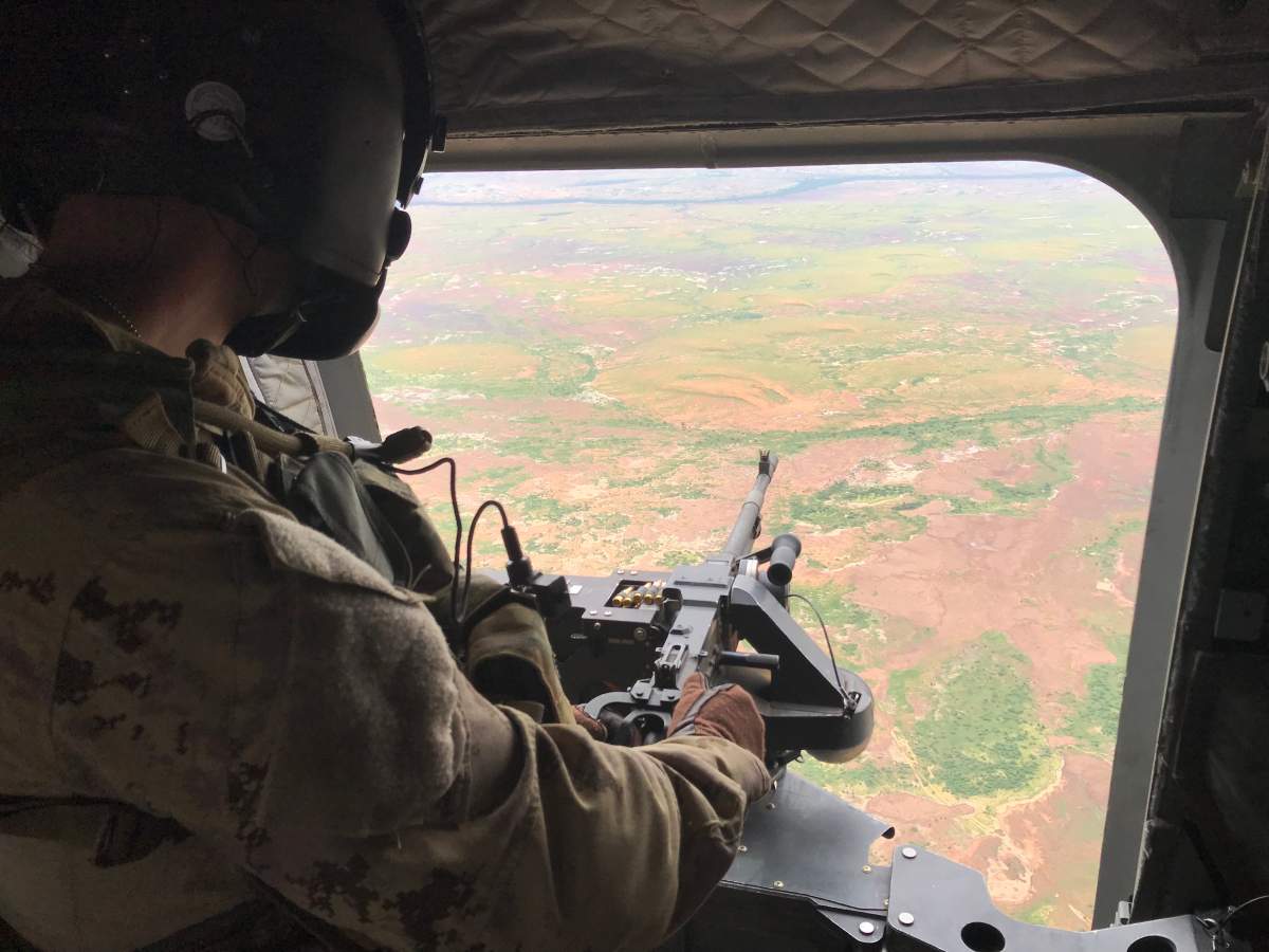 A Canadian peacekeeper as a right gunner on the Chinook helicopter.