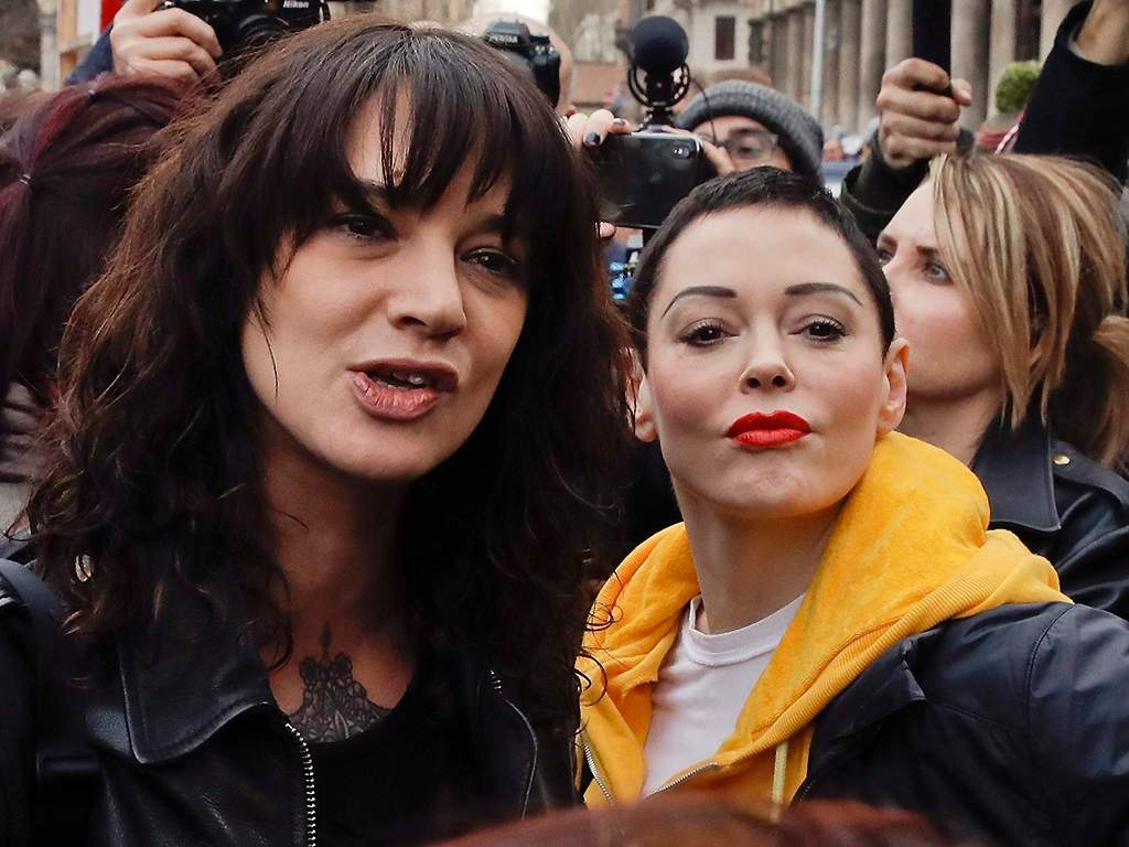 Asia Argento (L) and Rose McGowan mark International Women's Day in Rome on March 8, 2018. 