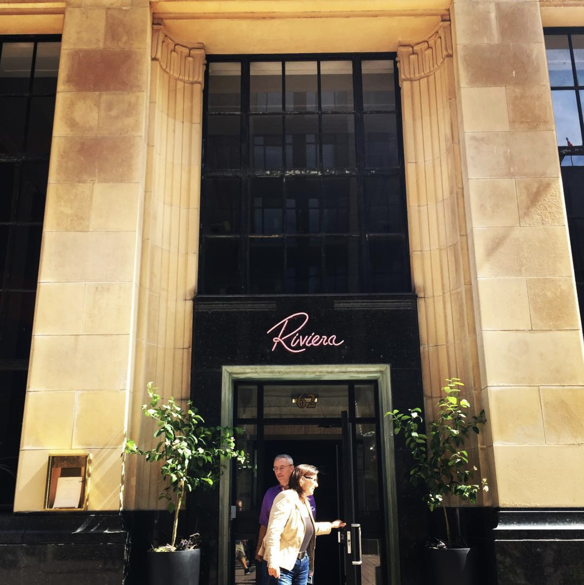 Riviera is located at 62 Sparks Street. The building used to house a branch of the Imperial Bank of Canada.