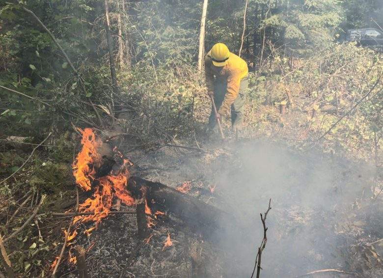 A Washington National Guard member fights the Sheep Creek Wildfire in Washington State Aug. 5, 2018. 