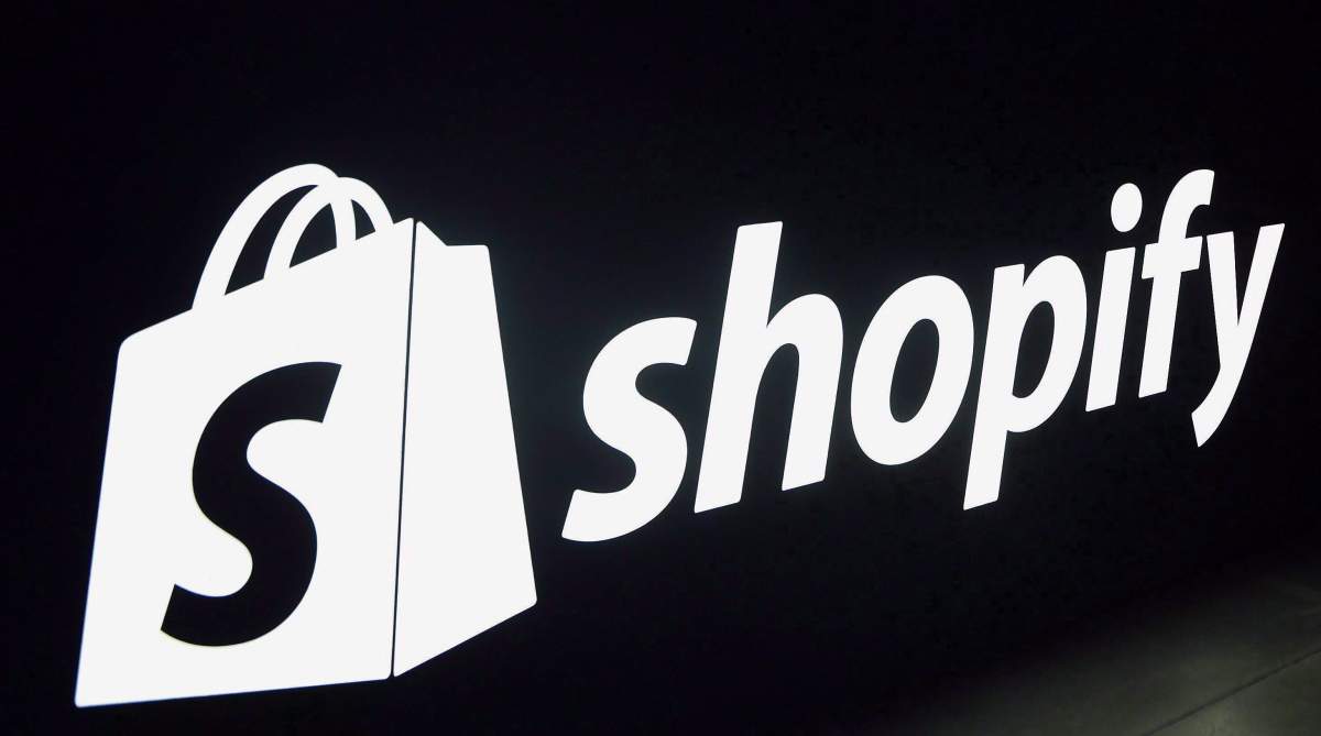 A Shopify logo is seen during an event in Toronto on Tuesday, May 8, 2018. Shopify is banning the sale of some firearms and their related parts through its platform.
