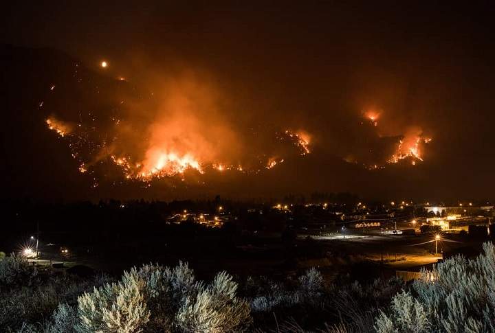 Multiple, bright orange hot spots from the Snowy Mountain wildfire lit up the sky near Keremeos on Monday night.