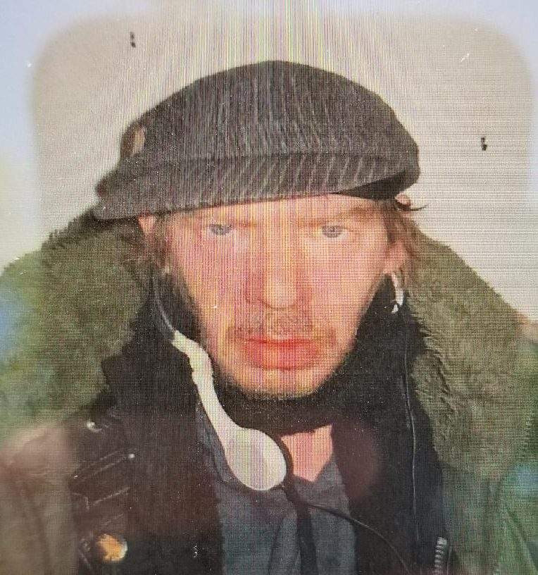 Sorrenti is described as a white male, is 5'9", and weighs 150lbs with brown shaggy hair. .