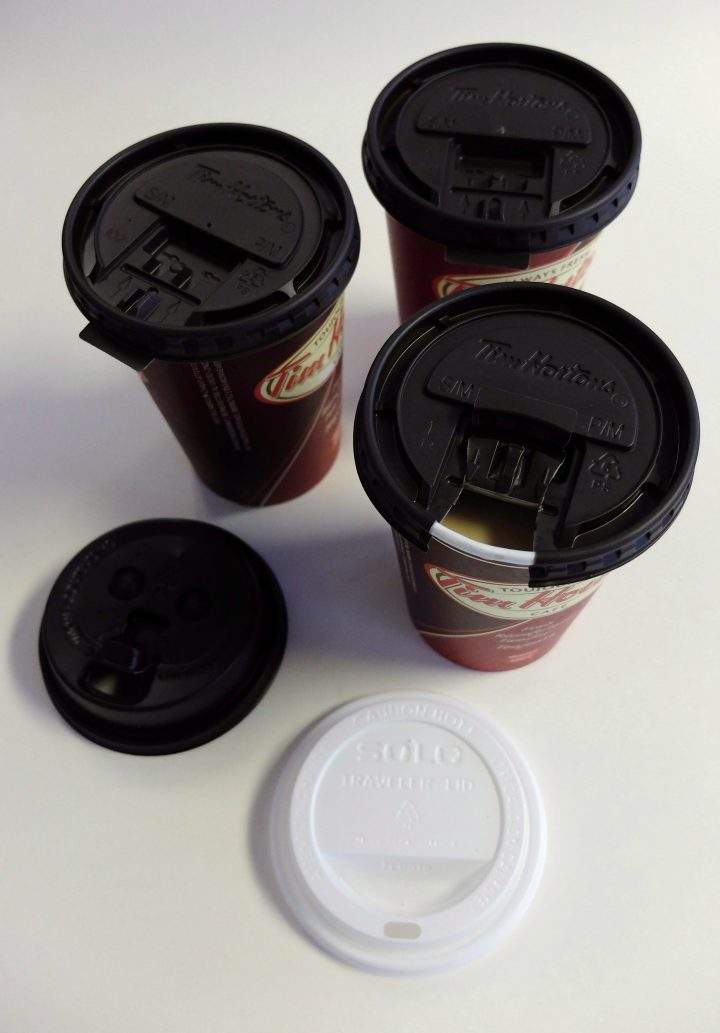 Three Tim Hortons coffee cups are shown, top, alongside lids from Starbucks, lower left, and Solo, lower right.
