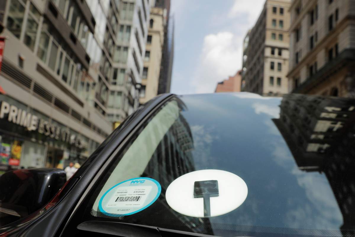 A car with an Uber logo.  