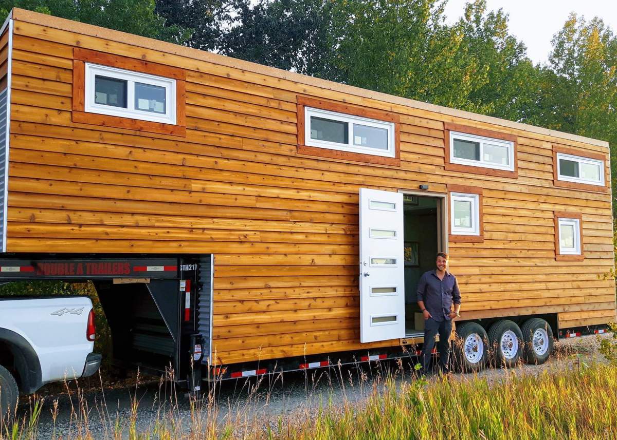 Vagabond Tiny Homes founder Thomas Grenier in front of his tiny show home.