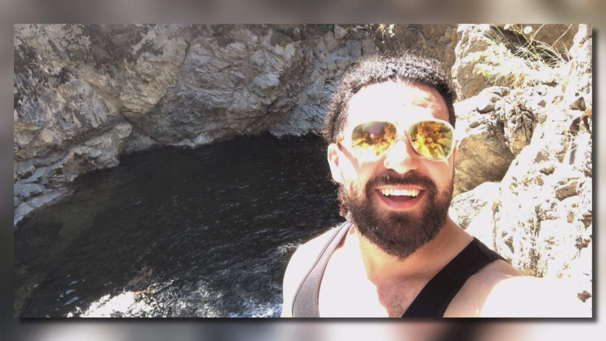 Belal Ajami poses at Fintry Falls north of Kelowna, B.C. He would go on to survive a 40-metre plunge down the falls.