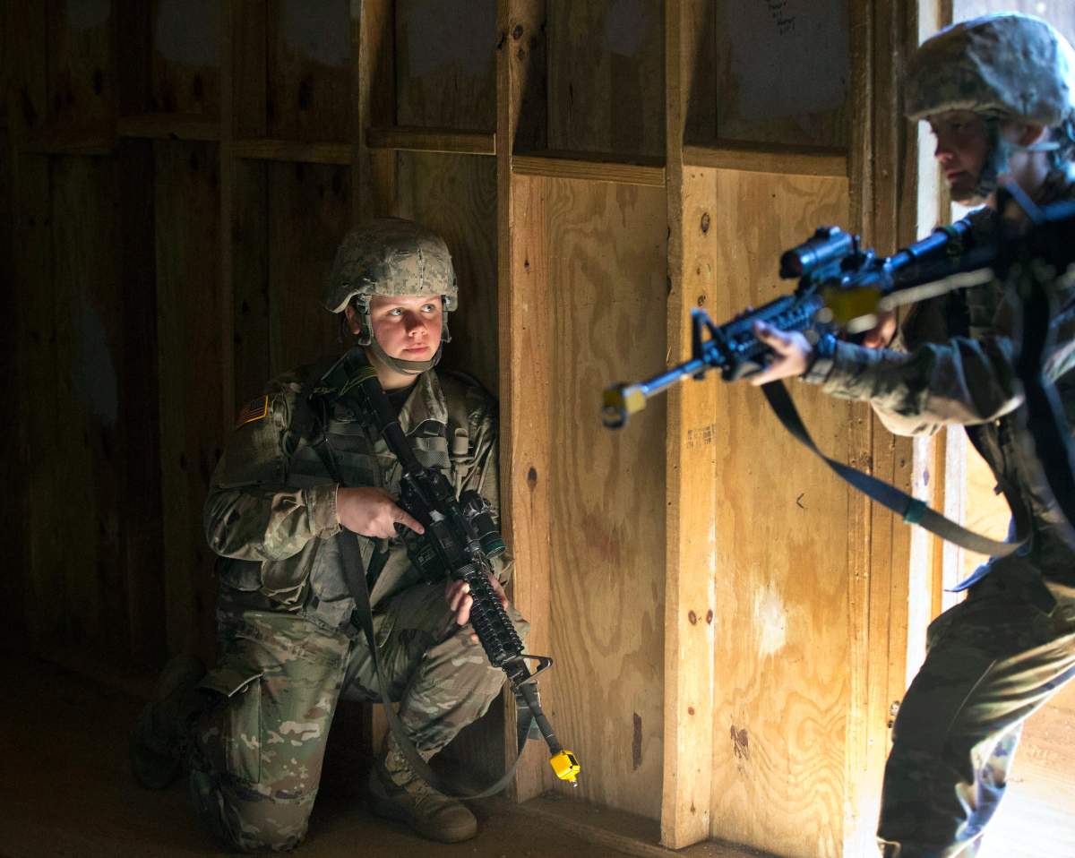 In this Oct. 4, 2017, photo, U.S. Army recruit Kirsten practices building clearing tactics with male recruits at Ft. Benning, Ga. 



