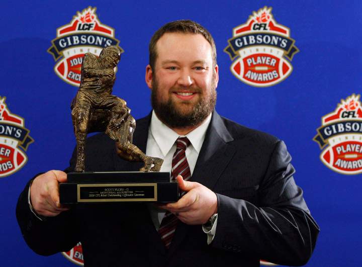 Scott Flory, of the Montreal Alouettes, holds his trophy for the CFL Most Outstanding Lineman during the 2009 Gibson's Finest Players Awards in Calgary on November 26, 2009. Punter Hank Ilesic, stalwart offensive lineman Scott Flory, late centre/linebacker Tom Hugo, defensive lineman Brent Johnson and defensive back Barron Miles will be inducted as players in the Canadian Football Hall of Fame. 