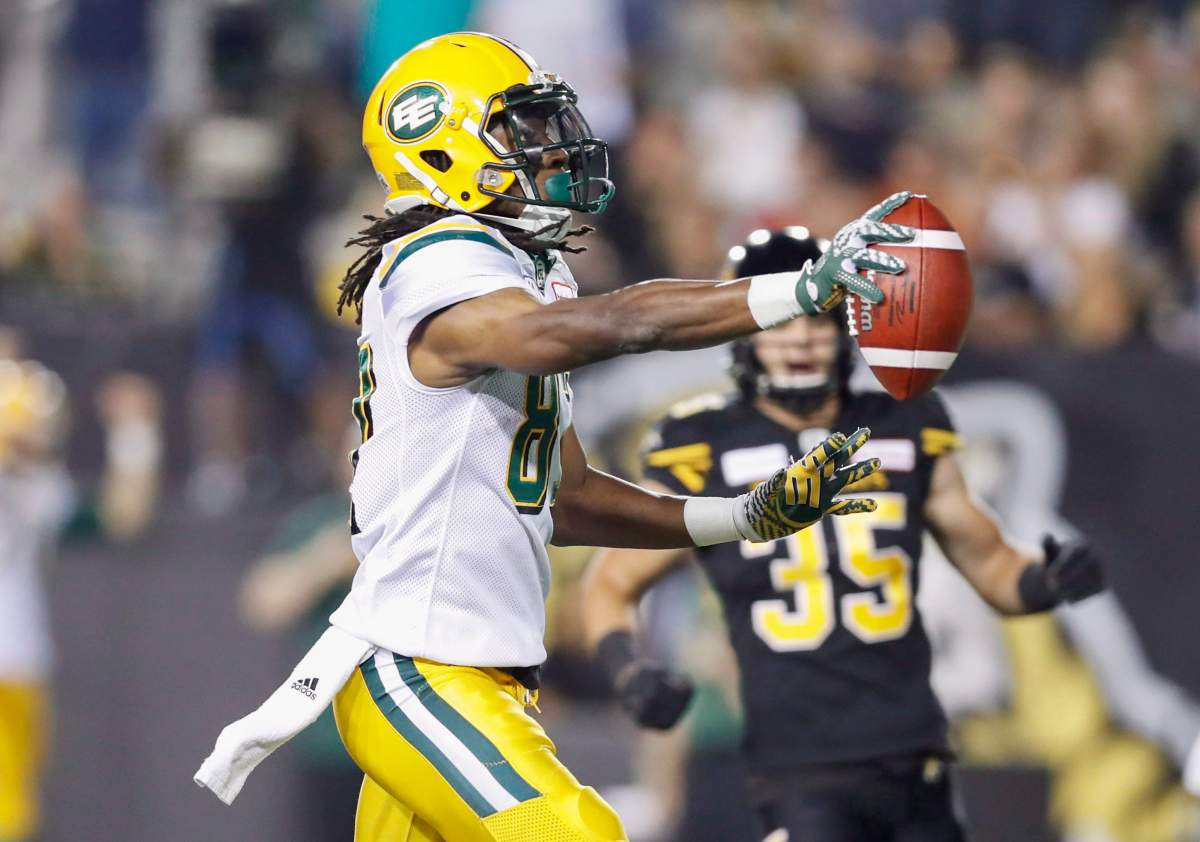 Edmonton Eskimos' Derel Walker scores a touchdown on the Hamilton Tiger-Cats during the first half of CFL football action in Hamilton, Ontario on Thursday August 23, 2018. 