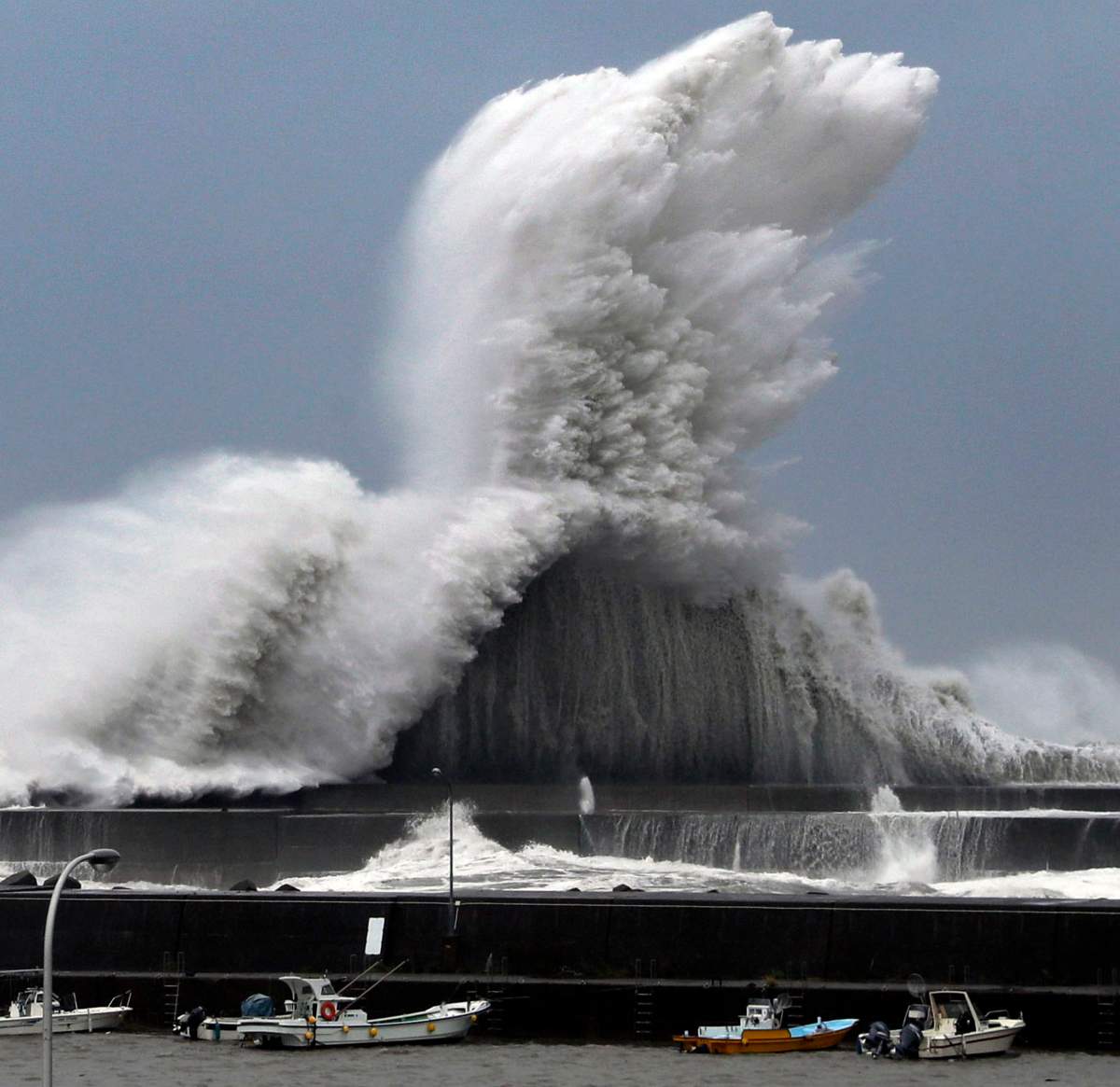 High waves hit breakwaters at a port of Aki, Kochi prefecture, Japan, Tuesday, Sept. 4, 2018.