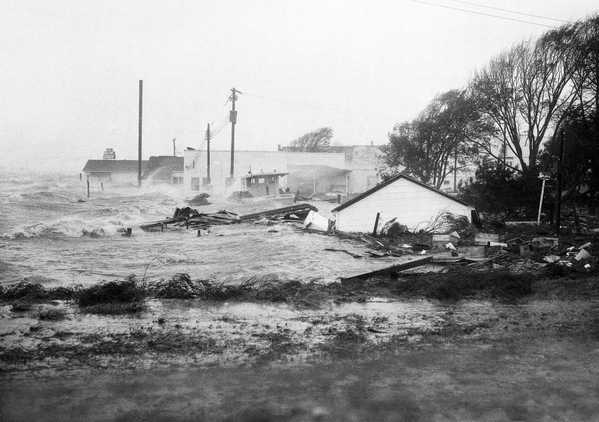 In this Oct. 15, 1954 file photo, High tides, whipped in by Hurricane Hazel, shatter boats and buildings in Swansboro, N.C., as the storm lashes the Atlantic seaboard.