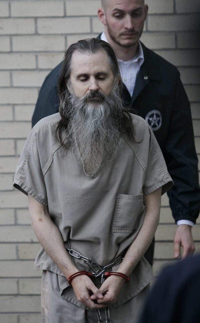 FILE – In this Dec. 10 2010, file photo, Brian David Mitchell is escorted by a U.S. Marshall as he arrives at the federal courthouse in Salt Lake City.