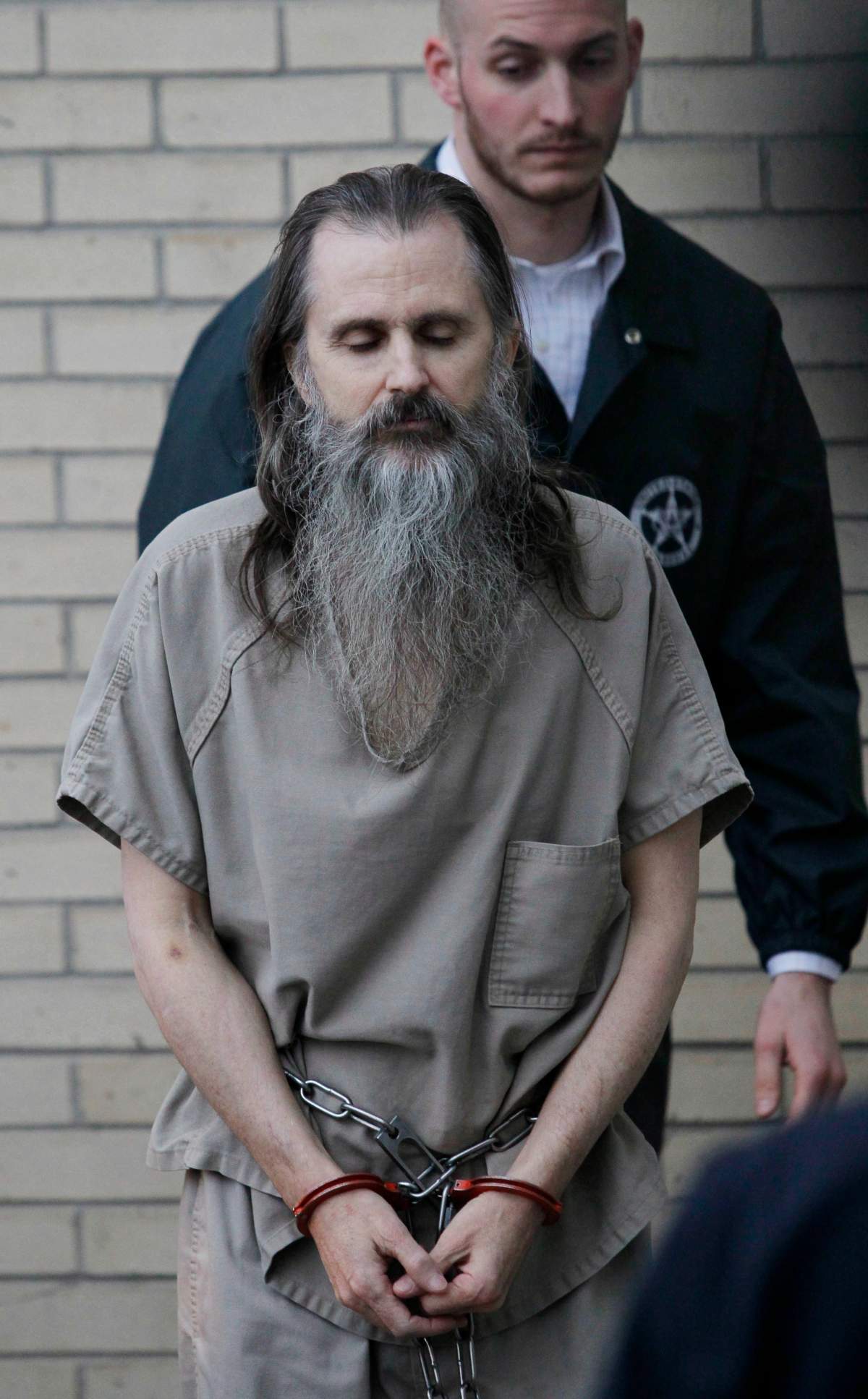 In this Dec. 10 2010, file photo, Brian David Mitchell is escorted by a U.S. Marshall as he arrives at the federal courthouse in Salt Lake City.