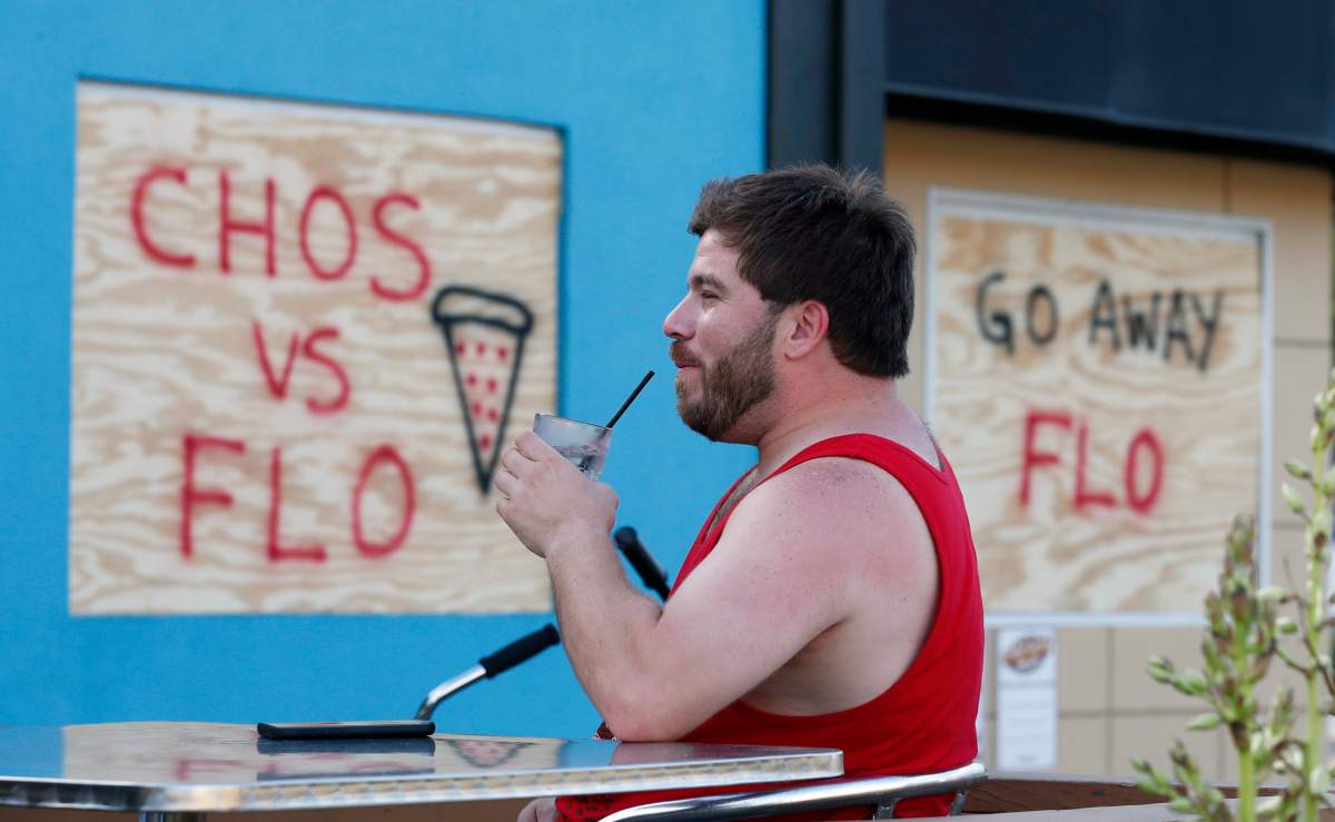 Beau Venaziano enjoys a beverage at Chicho’s, Tuesday, Sept. 11, 2018, in Virginia Beach, Va., before the arrival of Hurricane Florence.