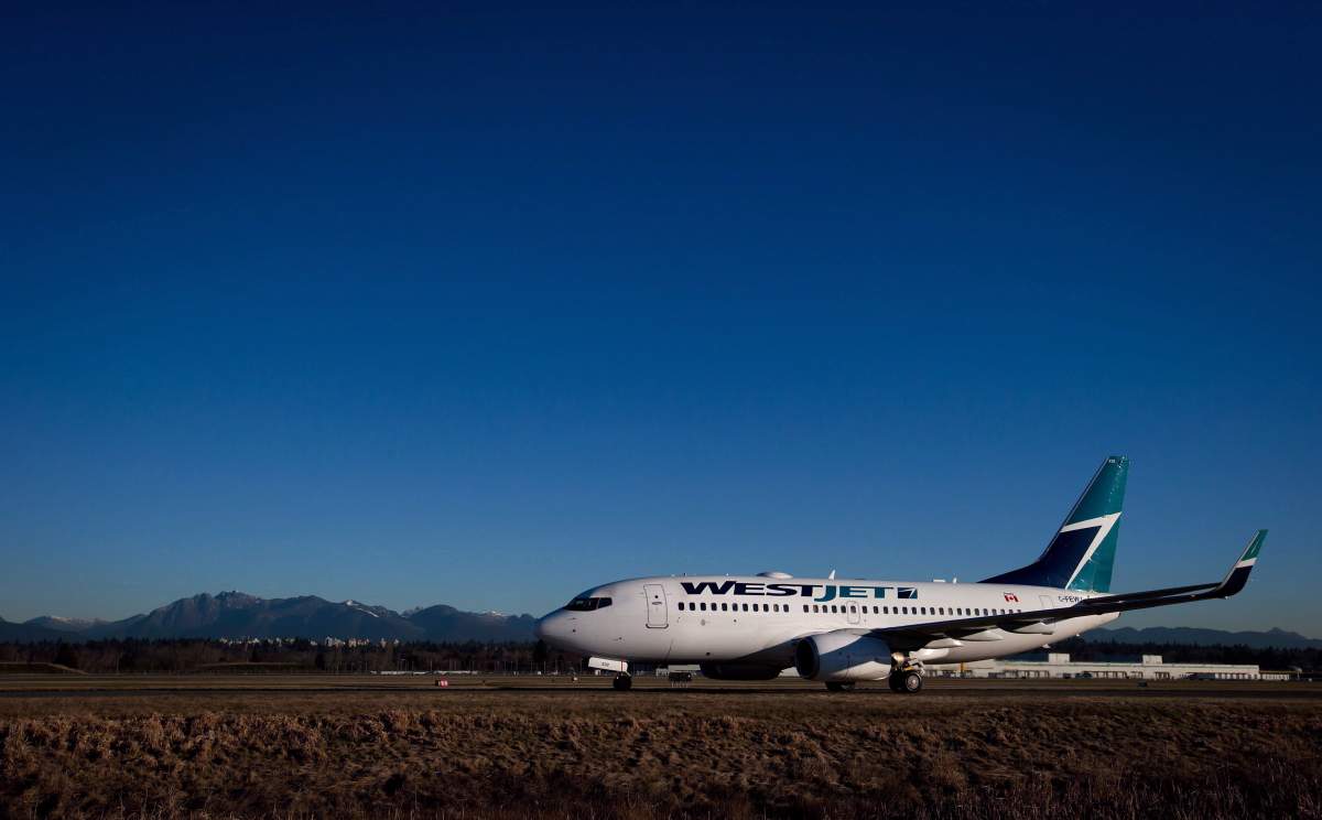 A Westjet Boeing 737-700 taxis to a gate after arriving at Vancouver International Airport in Richmond, B.C., on February 3, 2014. 