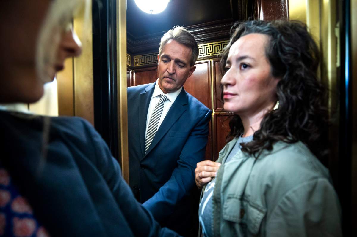 Ana Maria Archila, right, confronts Republican Senator from Arizona Jeff Flake (L) in an elevator after Flake announced that he vote to confirm Supreme Court nominee Brett Kavanaugh in the Russell Senate Office Building in Washington, DC, USA, 28 September 2018.