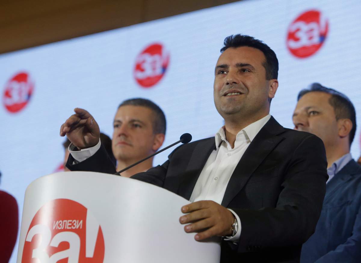 Macedonia's Prime Minister Zoran Zaev talks to members of the media during a news conference about the referendum in Skopje, Macedonia, late Sunday, Sept. 30, 2018.