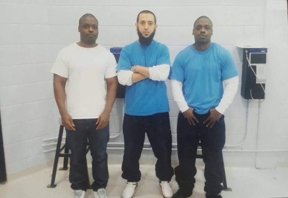 Zakaria Amara, centre, in a photo posted on a Facebook page that has been removed.