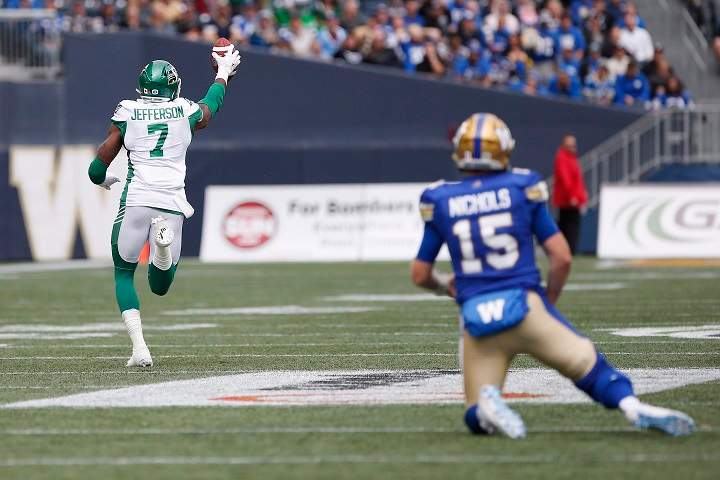 Winnipeg Blue Bombers quarterback Matt Nichols (15) looks on as Saskatchewan Roughriders' Willie Jefferson (7) runs for the touchdown after intercepting Nichols' pass during first half CFL action in the 15th annual Banjo Bowl in Winnipeg Saturday, September 8, 2018.