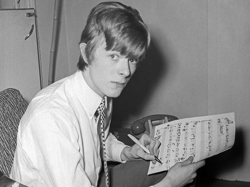 David Bowie poses for a portrait at home circa 1966 in London, England.