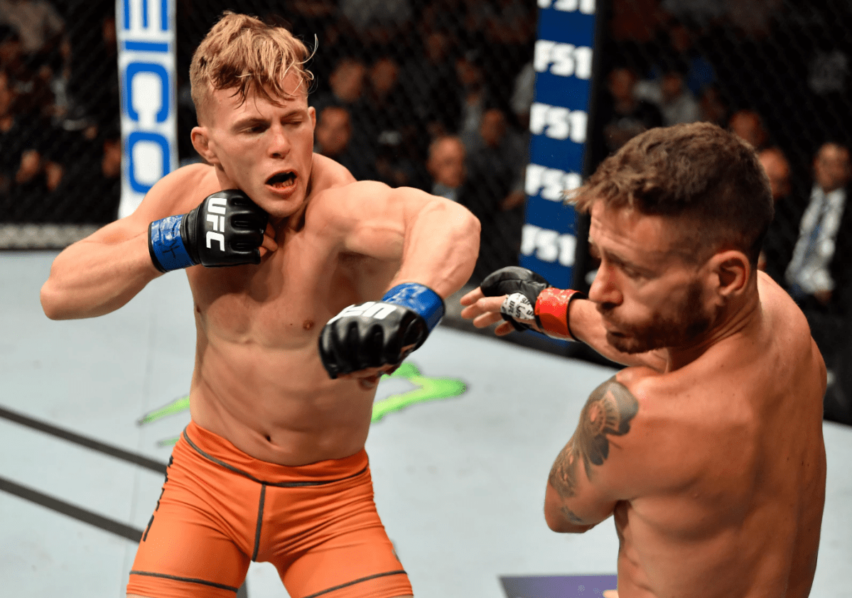 (L-R) Brad Katona of Canada punches Jay Cucciniello of Ireland in their featherweight bout during The Ultimate Fighter Finale event inside The Pearl concert theater at Palms Casino Resort on July 6, 2018 in Las Vegas, Nevada. 