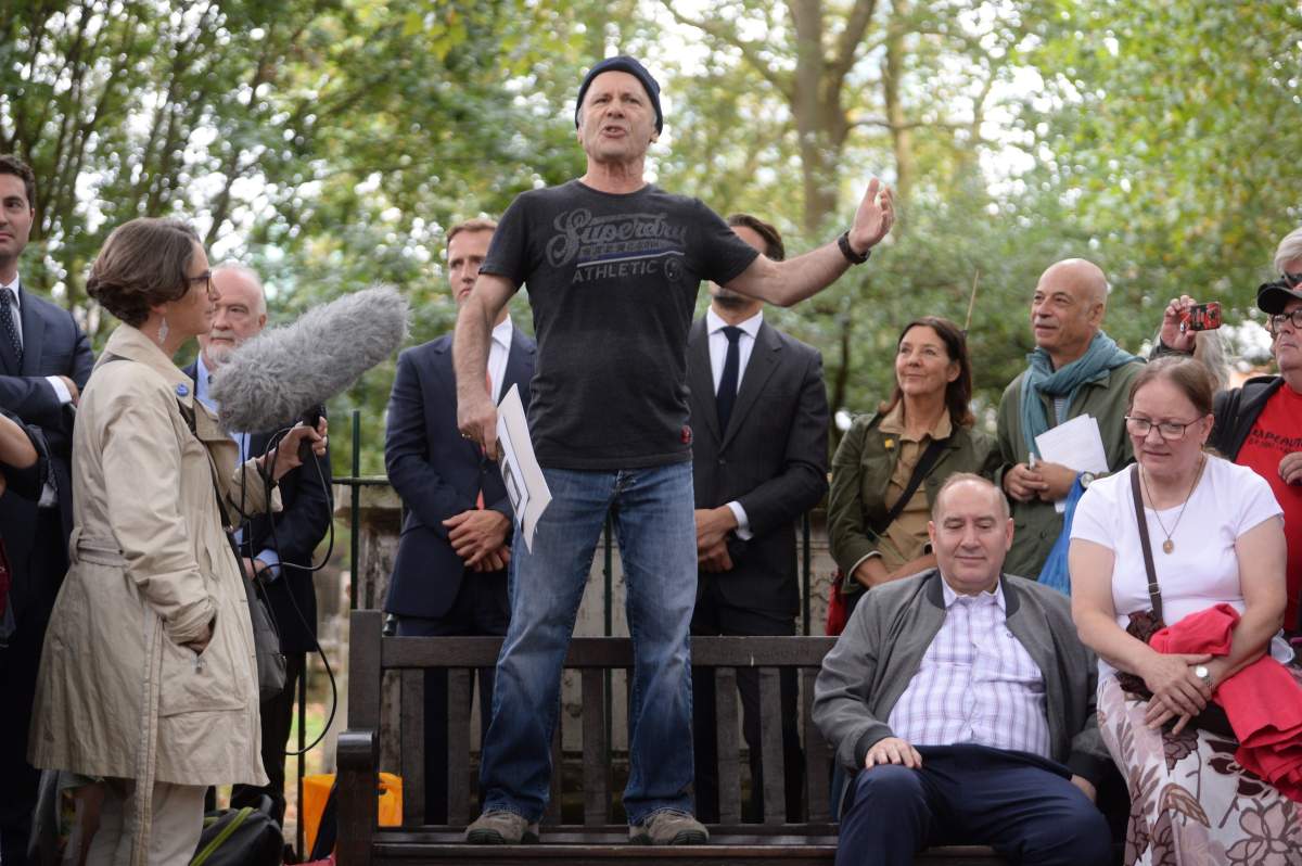 Iron Maiden lead singer Bruce Dickinson speaks at Bunhill Fields in London.