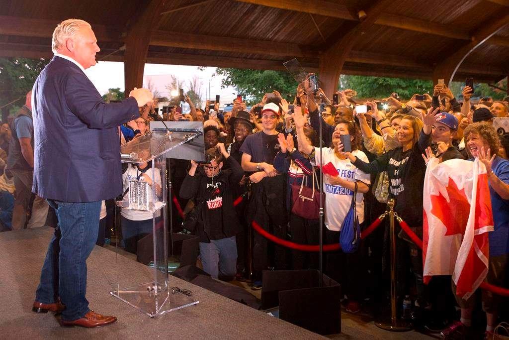 Ontario Premier Doug Ford greets the crowd as he takes the stage at Ford Fest in Vaughan , Ontario, on September 22, 2018.