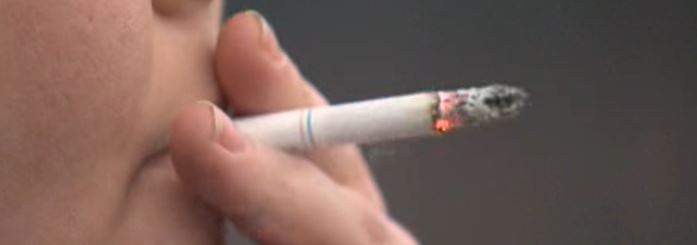 FILE - Most smokers don't know sugar is added to their cigarettes.