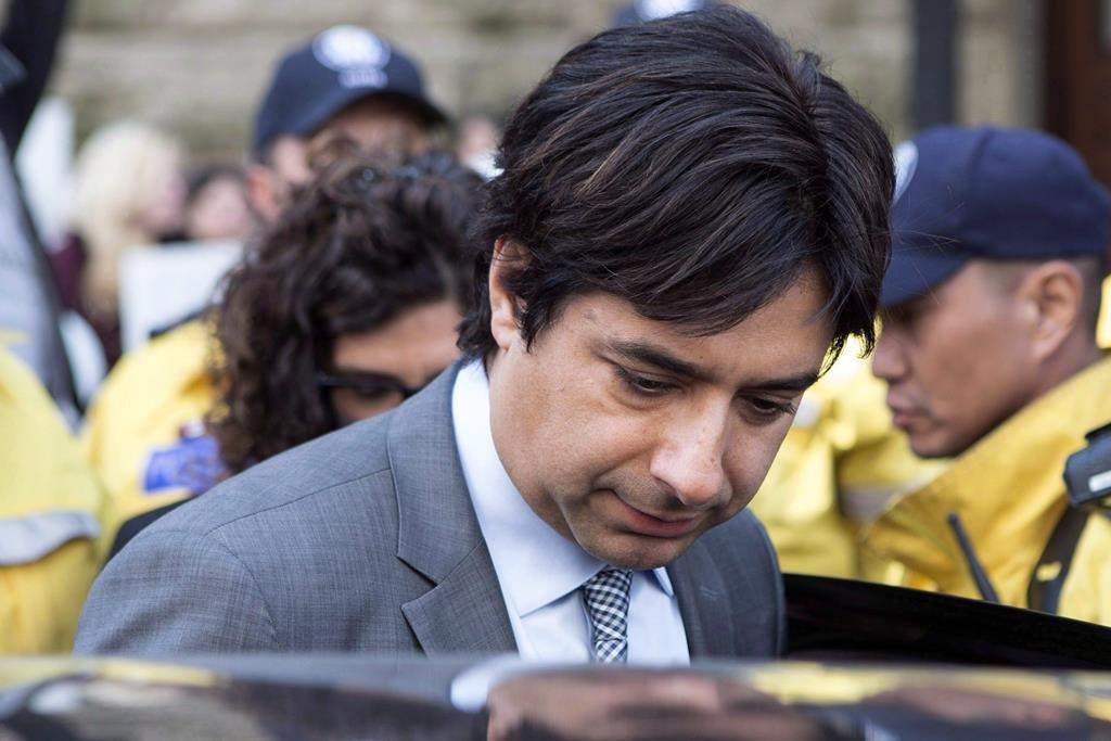 Former CBC radio host Jian Ghomeshi leaves a Toronto court after signing a peace bond, on May 11, 2016.