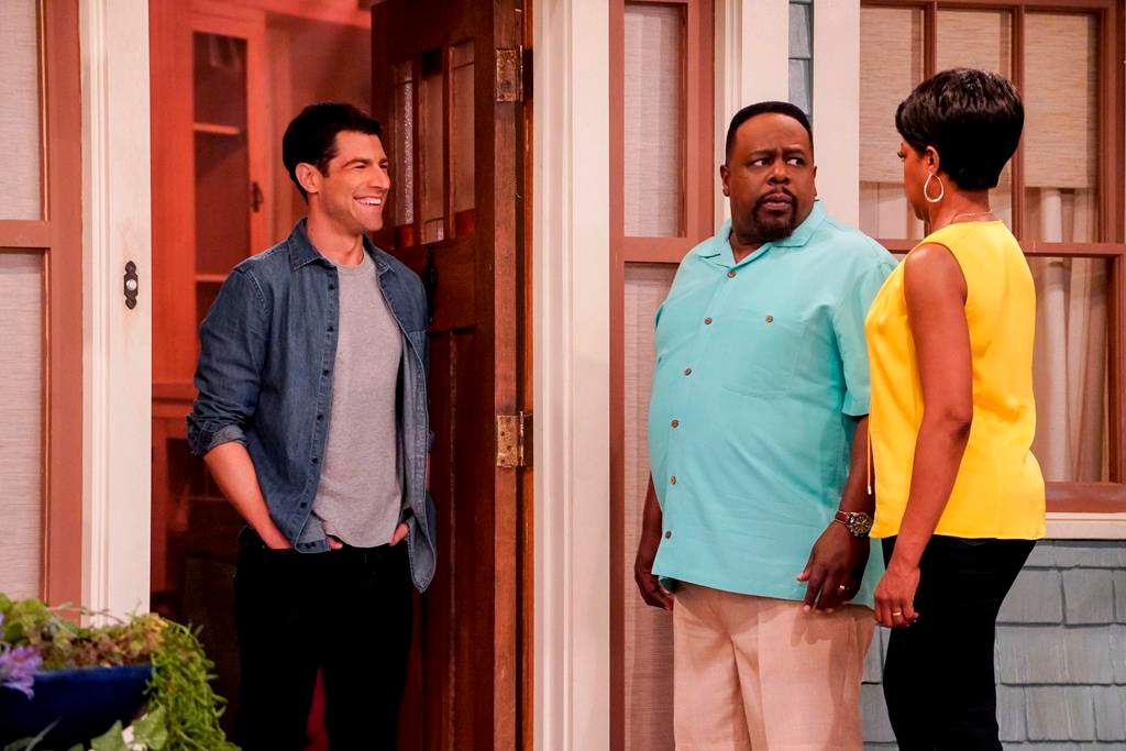 “The Neighborhood” cast members Max Greenfield, left to right, as Dave Johnson, Cedric the Entertainer as Calvin Butler and Tichina Arnold, as Tina Butler. THE CANADIAN PRESS/HO-CBS, Bill Inoshita,