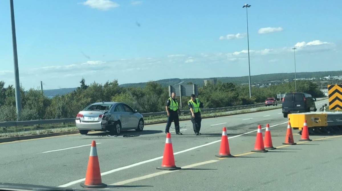 Police block off a section of Victoria Road in Dartmouth following a crash involving a motorcycle and vehicle. 