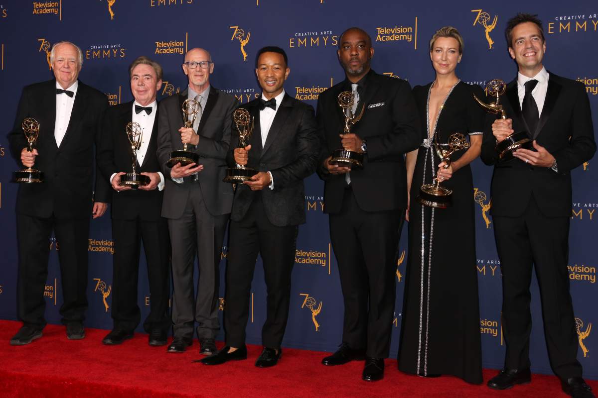 (L-R) Tim Rice, Andrew Lloyd Webber, Neil Meron, John Legend, Mike Jackson, Ty Stiklorius, and Alex Rudzinski in the press room of the 2018 Creative Arts Emmy Awards.