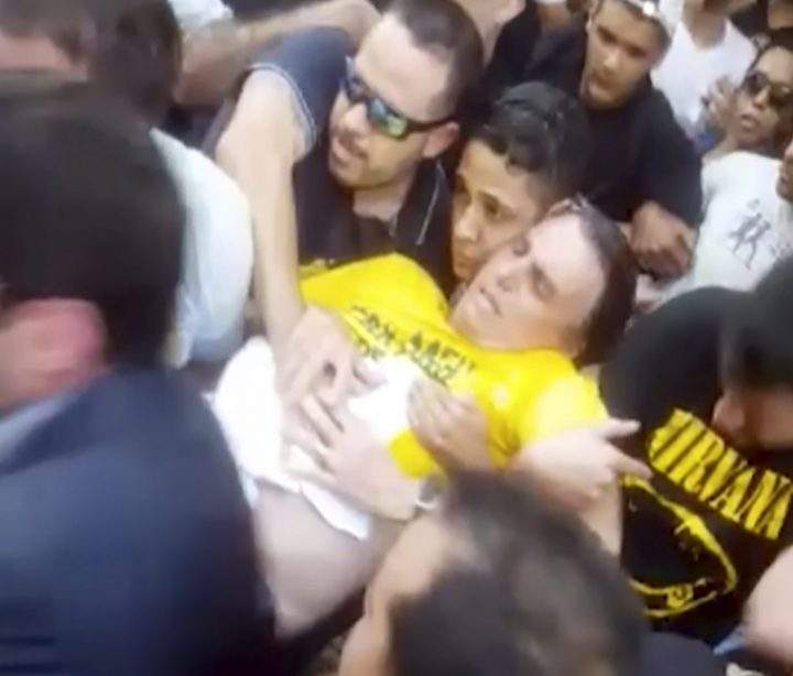 In this video still, National Social Liberal Party presidential candidate Jair Bolsonaro is carried away after being stabbed during a campaign rally in Juiz de Fora, Brazil, Thursday, Sept. 6, 2018.