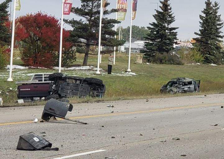 Several damaged vehicles are seen in a ditch off Gateway Boulevard, south of Ellerslie Road, in Edmonton late Sunday morning.
