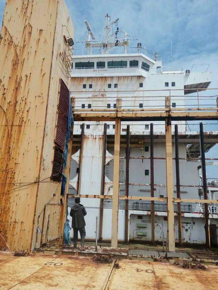 A man is shown on the deck of the Sam Ratulangi cargo ship.