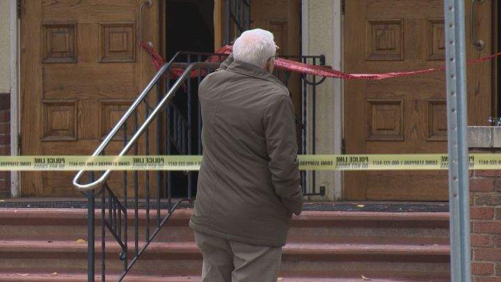 David Brooks looks at the damage sustained by Highlands United Church after a fire there on Friday.