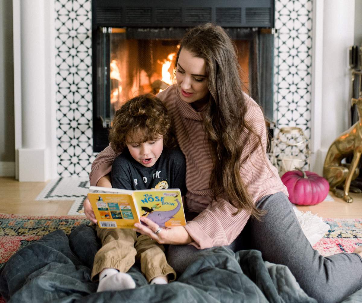 Blogger Kira Paran of Northern Style reads to her son.