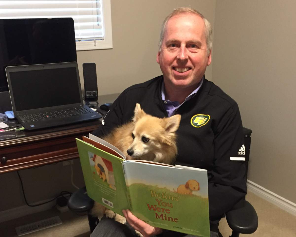 Edmonton Eskimos President & CEO Len Rhodes and his dog Bella.