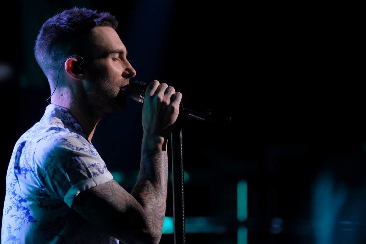 Adam Levine performing with Maroon 5.