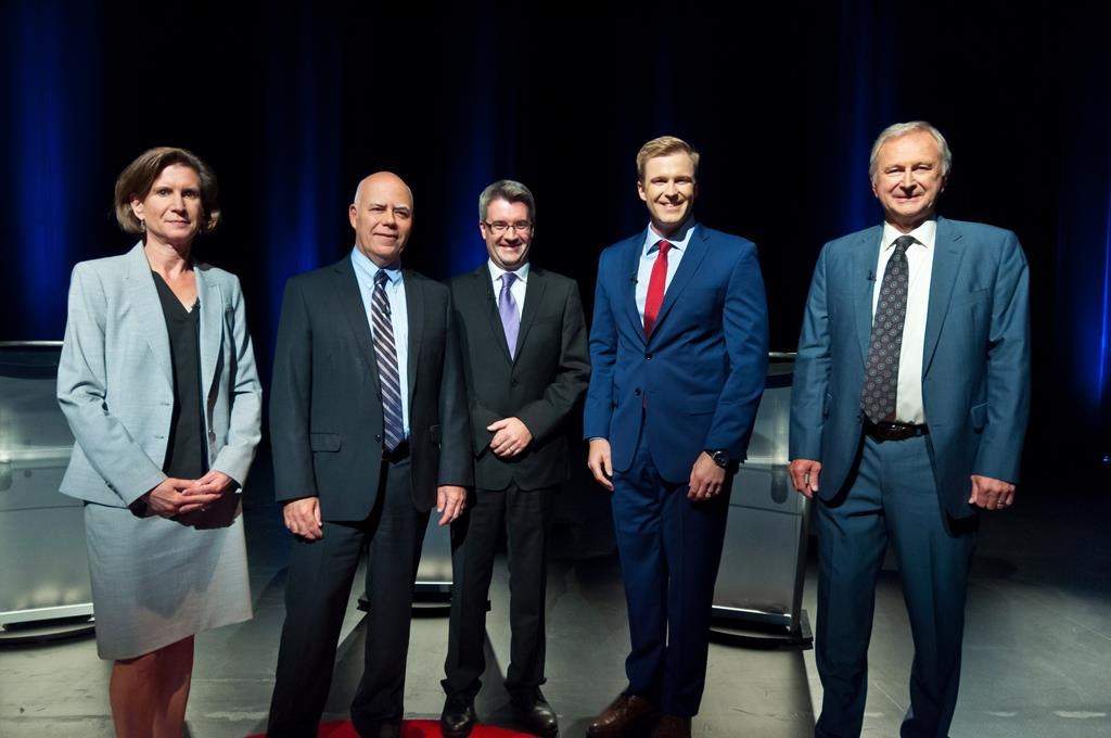NDP Jennifer McKenzie, left to right, Green Party David Coon, People's Alliance Kris Austin, Liberal Brian Gallant, PC Blain Higgs pose for photos before the start of the New Brunswick leaders debate in Riverview, New Brunswick on Wednesday September 12, 2018. THE CANADIAN PRESS/Marc Grandmaison.