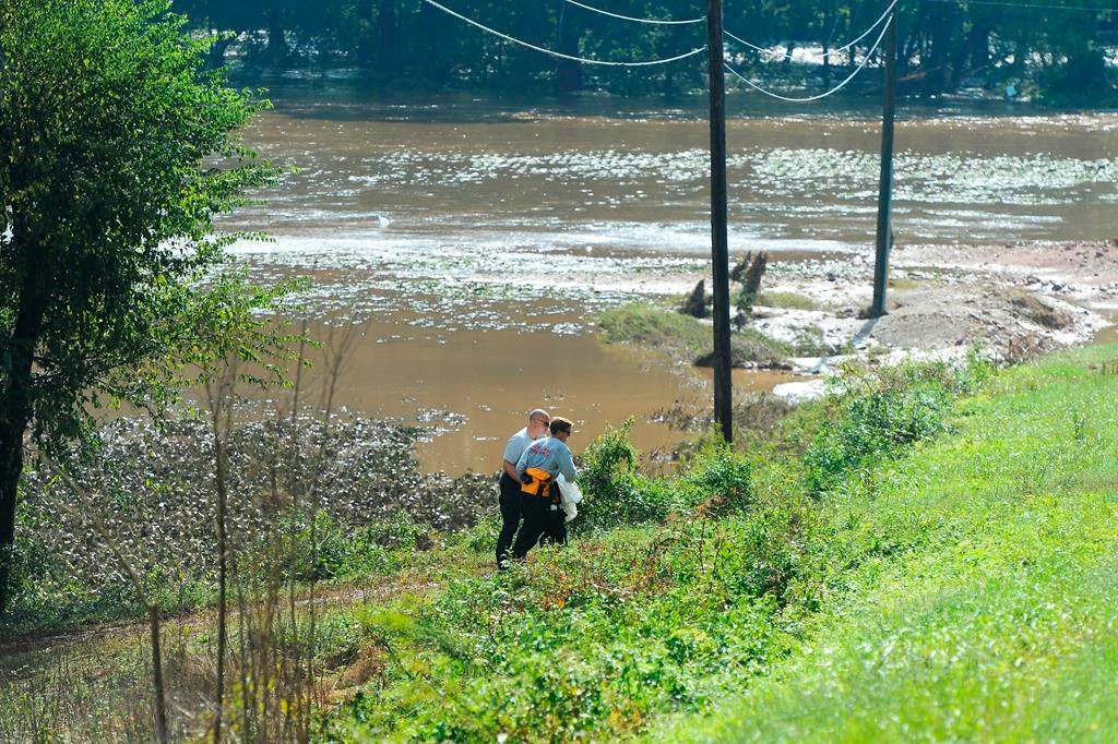 Rescue workers recover the body of a 1-year-old in Union County on Monday, Sept. 17, 2018 after the child was swept away in floodwaters resulting from the remnants of Hurricane Florence on Sunday.