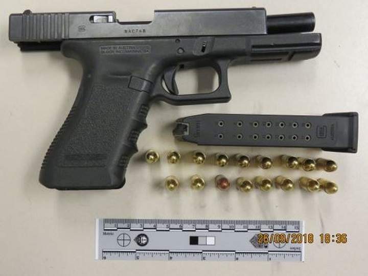 Loaded 9 mm firearm, allegedly seized during arrest of man charged in Attempt Murder investigation