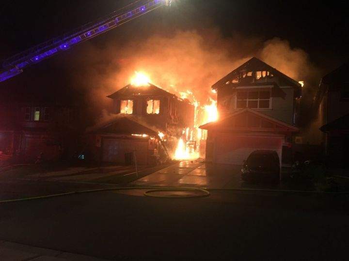 A fire on Panamount Common N.W. in the Calgary community of Panorama Hills heavily damaged two homes and caused minor damage to a third on Sept. 5, 2018.