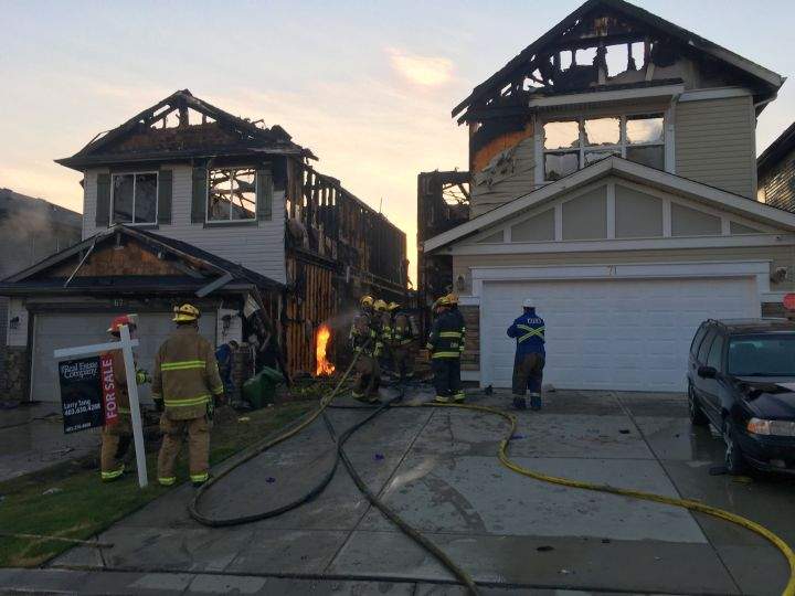 A two-alarm fire in the community of Panorama Hills in Calgary severely damaged two homes and caused minor damage to a third on Sept. 5, 2018.