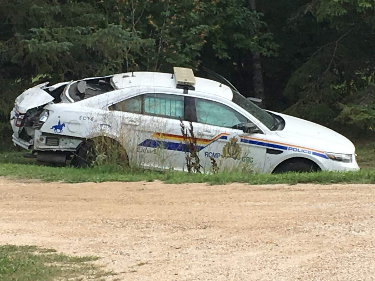 RCMP said the officer was not injured when a semi truck smashed into this cruiser Monday.