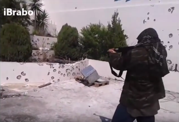Sami Elabi, who left Montreal to join a terrorist group in Syria, tries to shoot his Canadian passport in a video posted on YouTube.