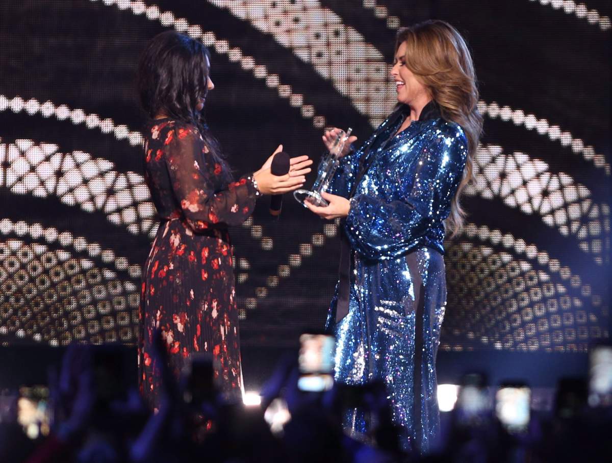 Shania Twain accepts the CCMA Generation Award from Alessia Cara at the Canadian Country Music Awards in Hamilton, Ont. on Sunday.